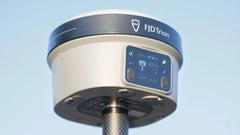 FJD Trion V10 rover on a carbon pole under open sky, RTK Fixed 43 of 43 on the rover screen