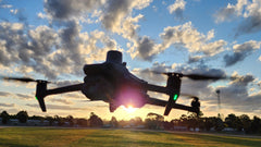 Mavic 3 Multispectral over an Australian paddock at last light, multispectral array on the top of the airframe
