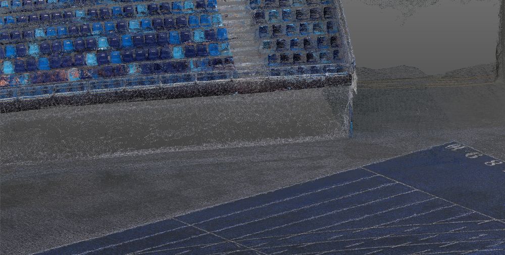 Seat rows and track at handheld density, next to the aerial surface.